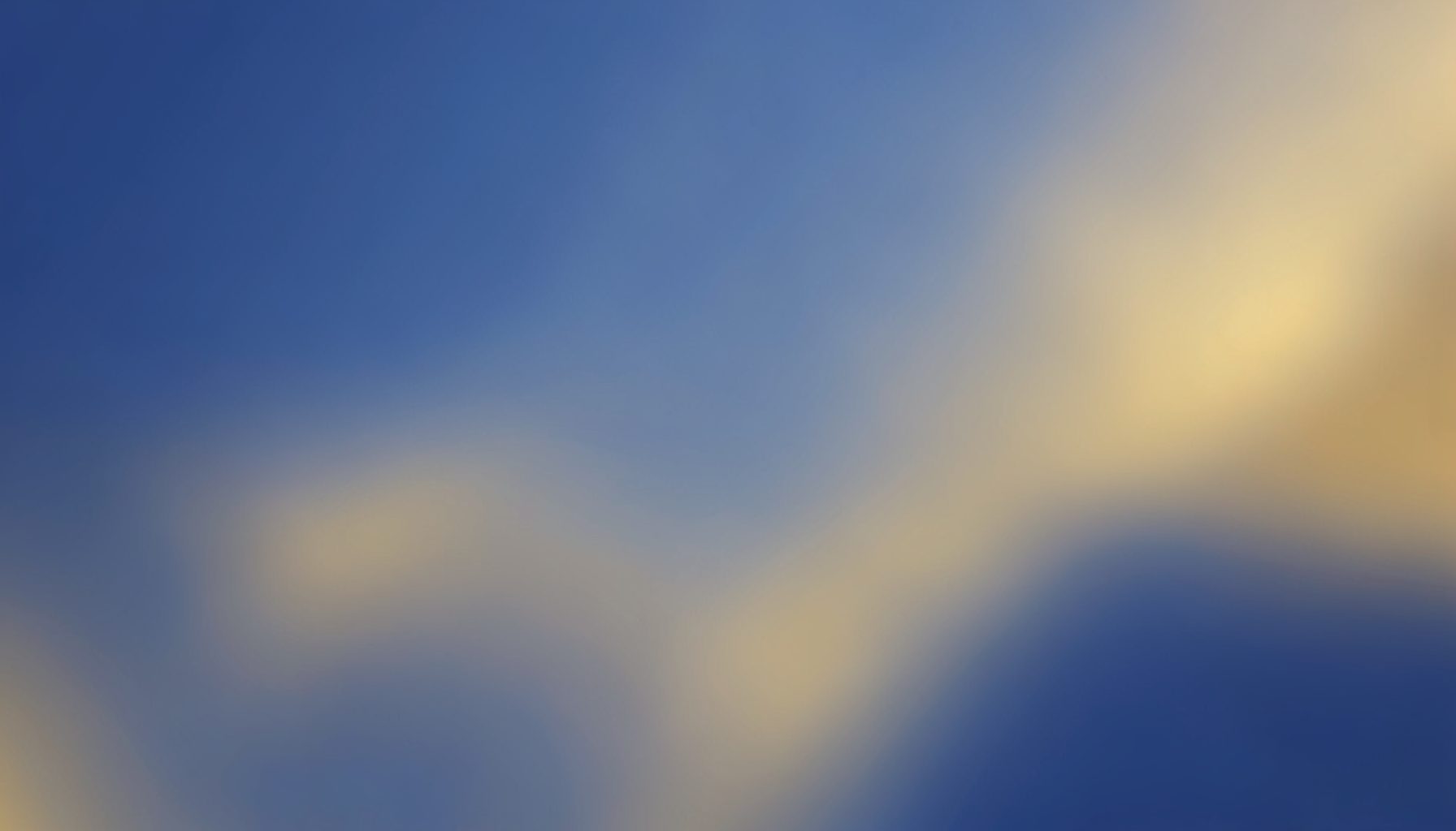 Soft navy blue and warm gold toned abstract background suggesting a calm digital support desk, with gentle light gradients