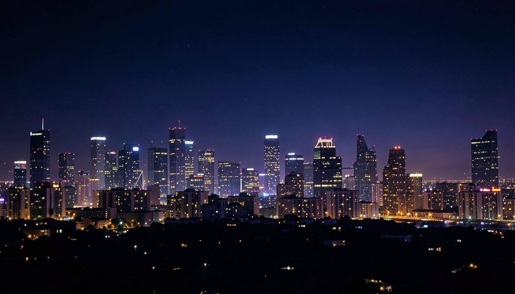 Wide night skyline in deep navy and soft purple tones with glowing gold light accents, evoking an entertainment streaming mood